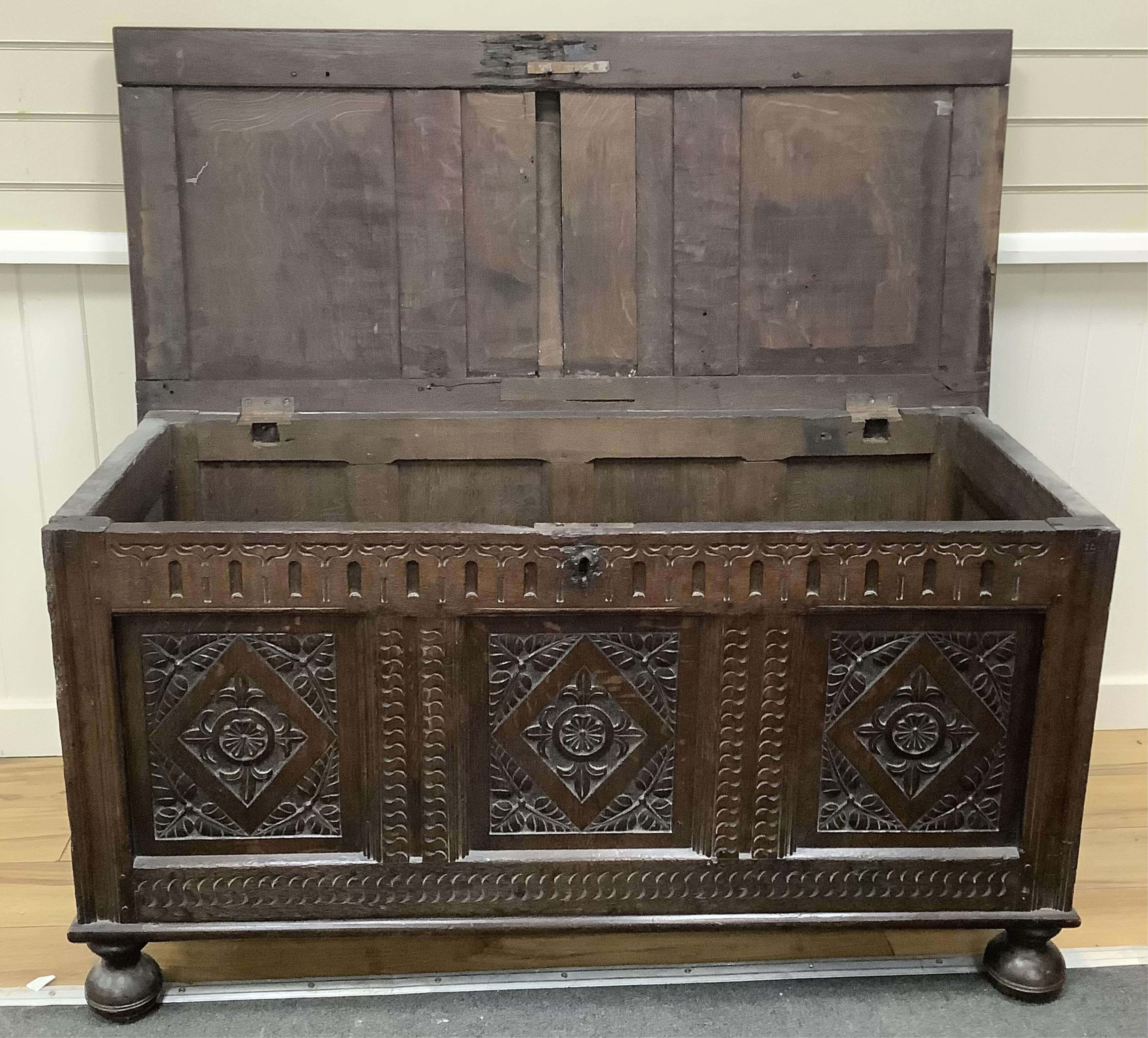 A 17th century and later carved oak coffer, width 128cm, depth 58cm, height 68cm. Condition -fair